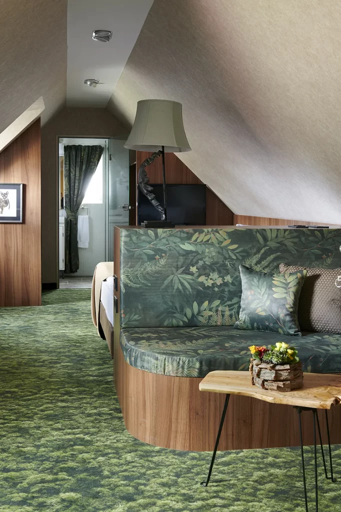 Luxury suite with carpet flooring for improved acoustic comfort