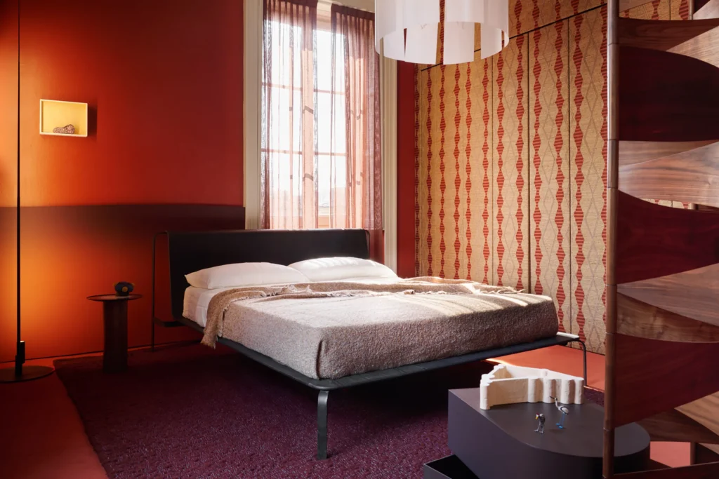 Hotel room featuring colorful flame retardant carpet and contemporary furnishings

