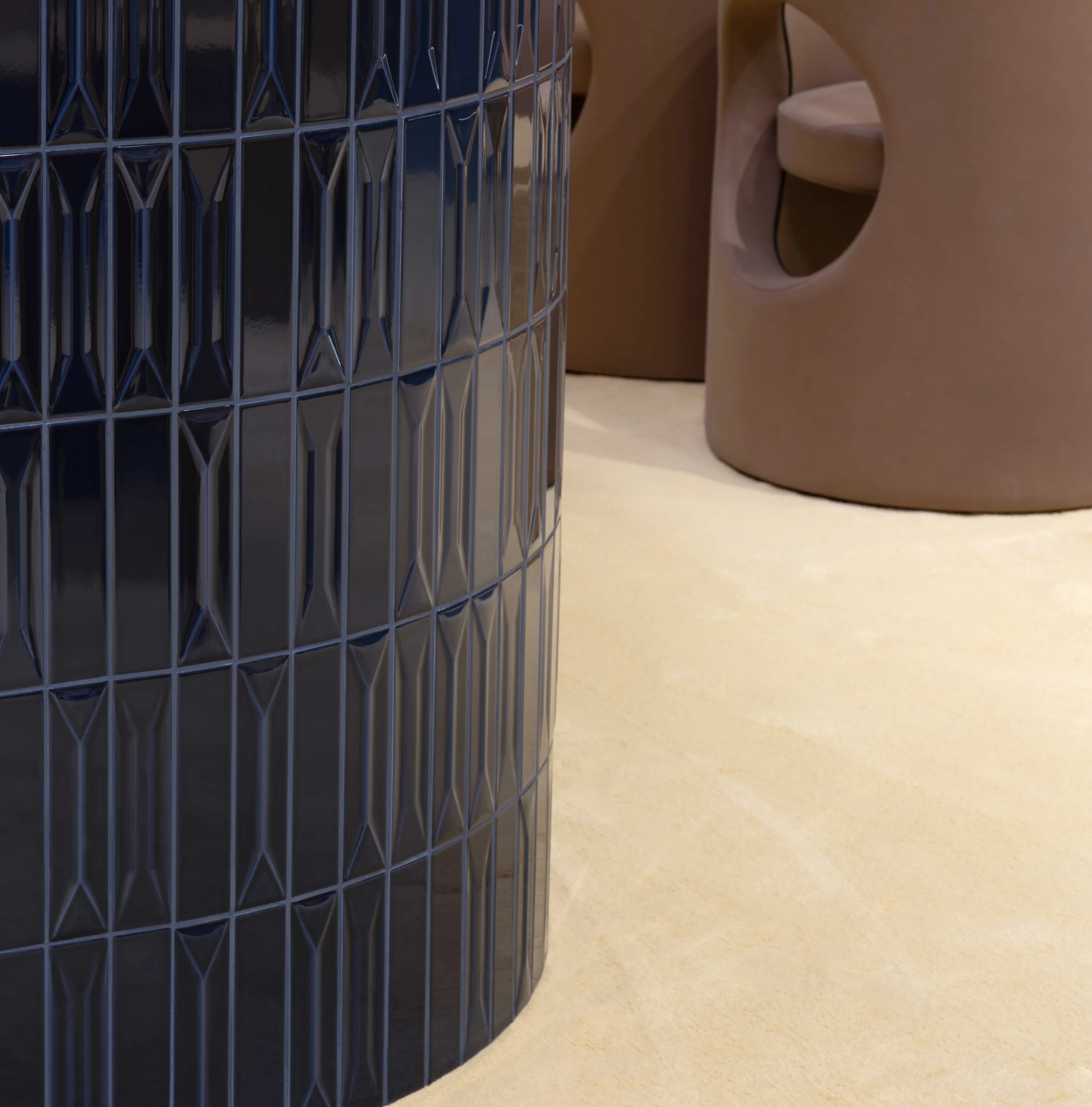 On the Sofa by Quintessenza Ceramiche, designed by Studio Salaris, featuring Dolcevita Vaniglia carpet by Radici Carpet.